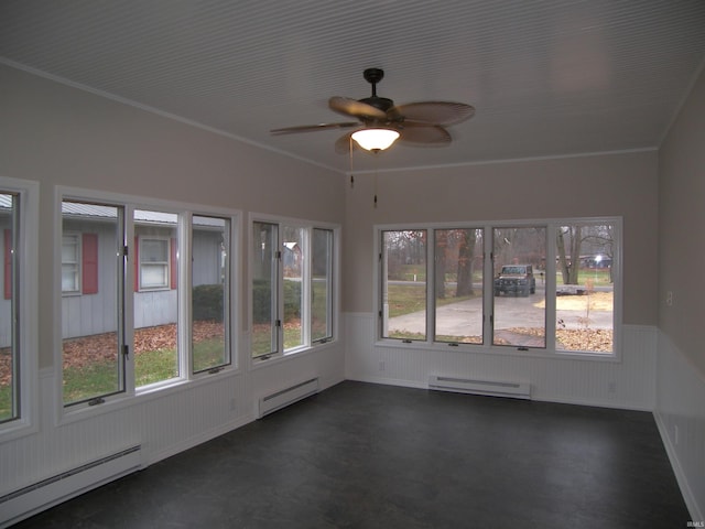 unfurnished sunroom with plenty of natural light and a baseboard heating unit