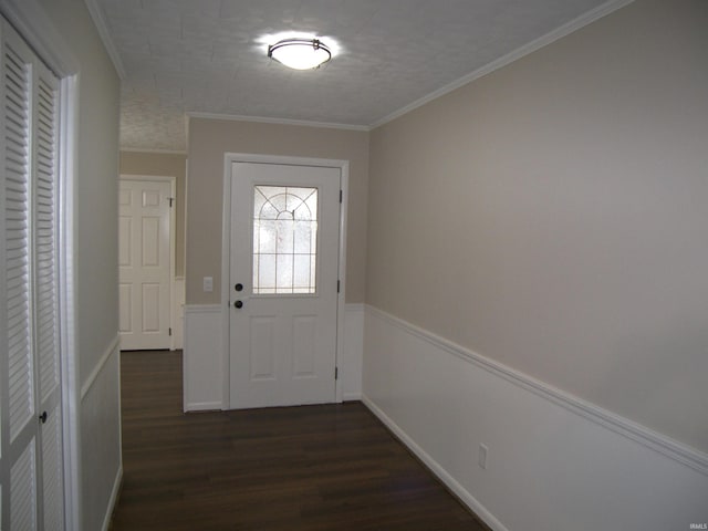 doorway featuring dark hardwood / wood-style floors and ornamental molding