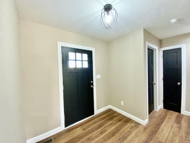 entryway with light hardwood / wood-style floors