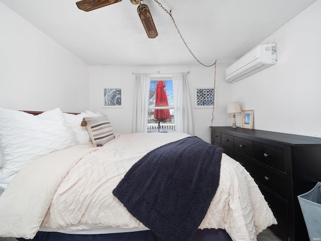 bedroom with ceiling fan and an AC wall unit