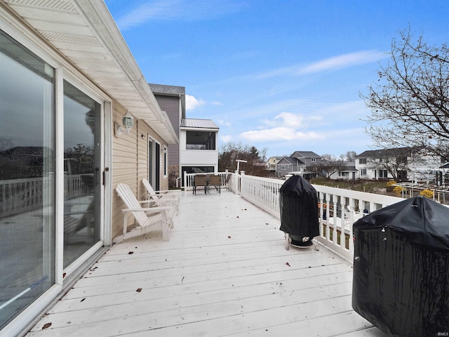 wooden deck featuring area for grilling