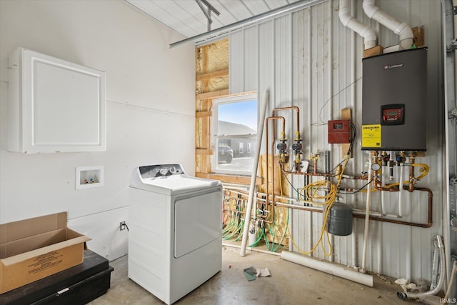 washroom featuring water heater and washer / dryer