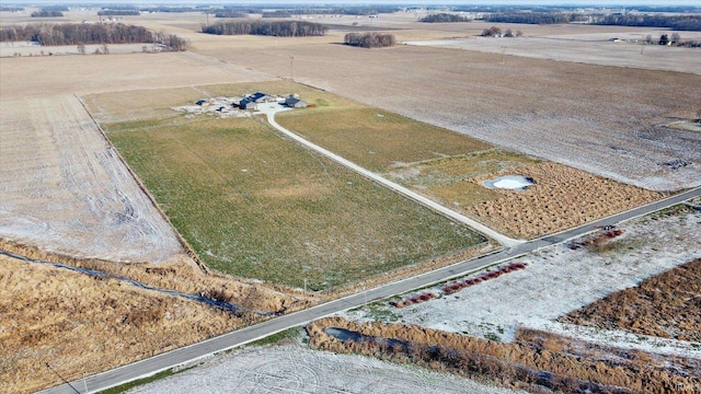 birds eye view of property with a rural view