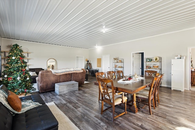 dining space with dark hardwood / wood-style flooring