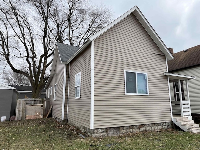 view of property exterior featuring a yard