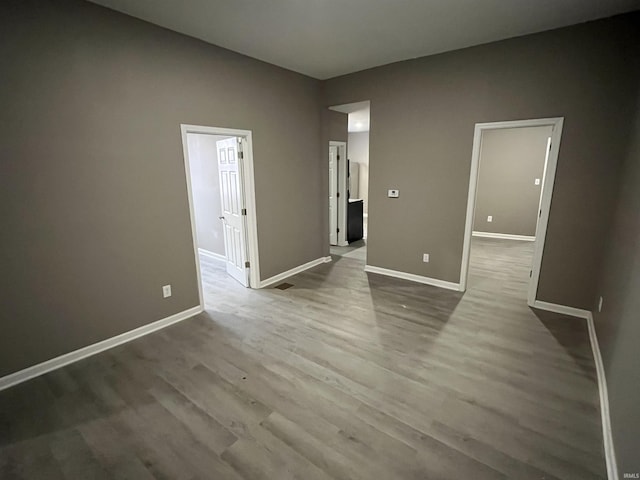 unfurnished room with light wood-type flooring