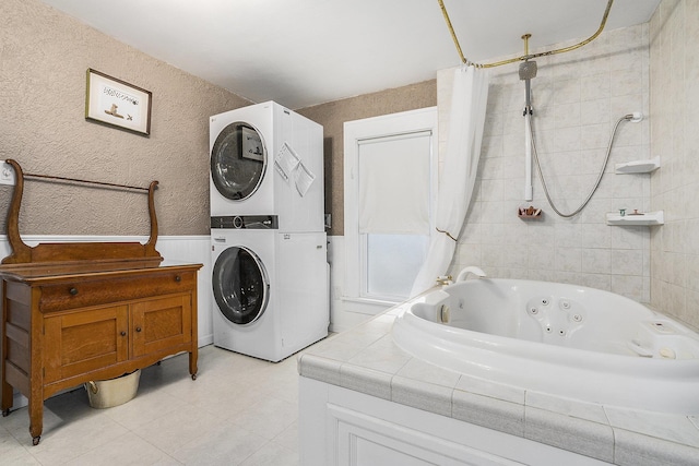 washroom with stacked washer / dryer