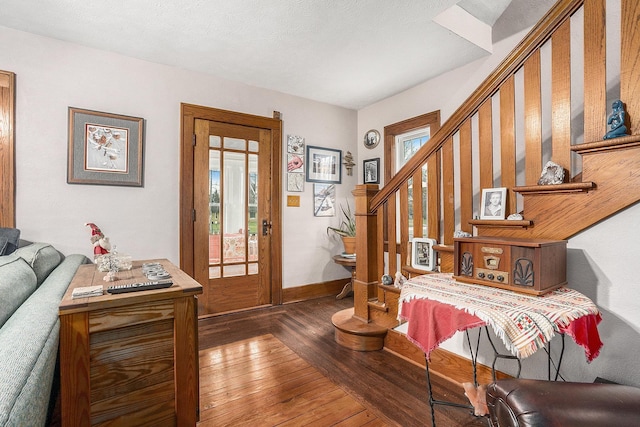 entrance foyer with a healthy amount of sunlight, french doors, and dark wood-type flooring