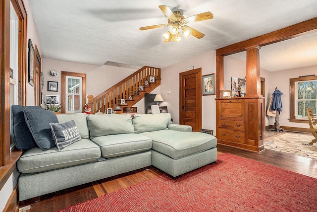 living room featuring hardwood / wood-style floors and ceiling fan