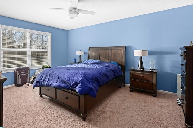 bedroom with light colored carpet and ceiling fan