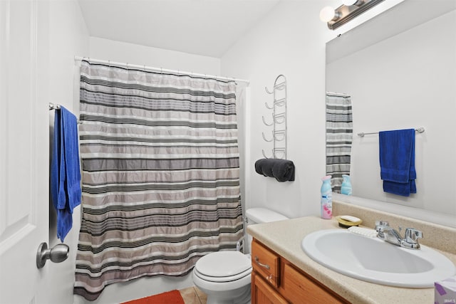 bathroom featuring tile patterned floors, vanity, a shower with shower curtain, and toilet