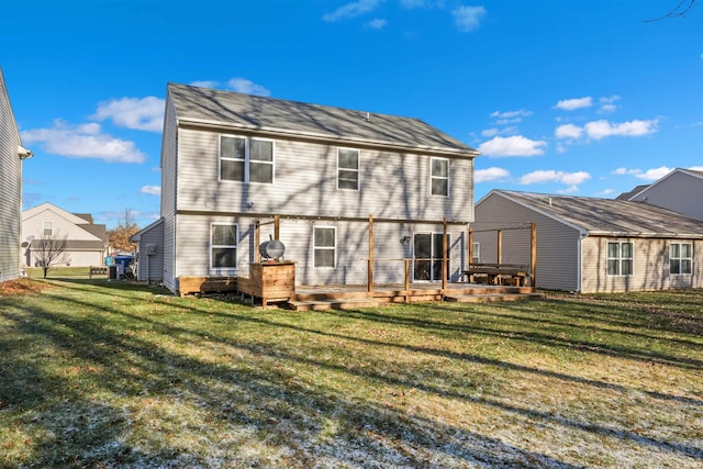 rear view of house with a yard