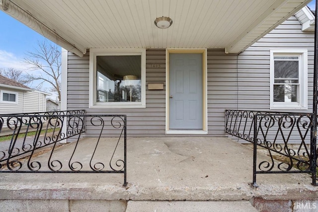 entrance to property with a porch