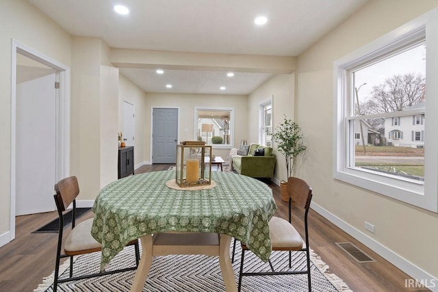 dining space featuring hardwood / wood-style floors