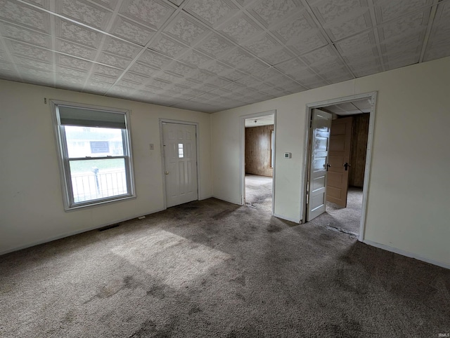 foyer with carpet flooring