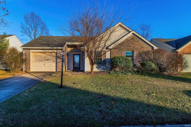 ranch-style home with a garage and a front lawn