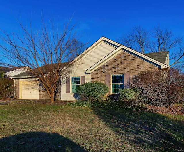 view of front of house with a garage and a front yard