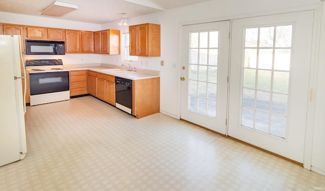 kitchen featuring sink and black appliances