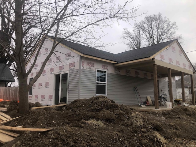 view of side of home with a patio area