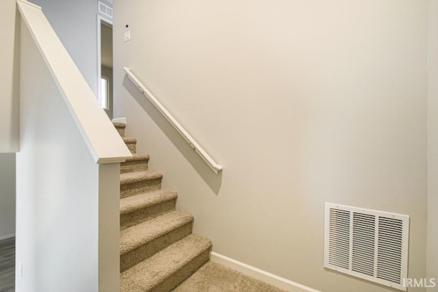 stairway with carpet floors