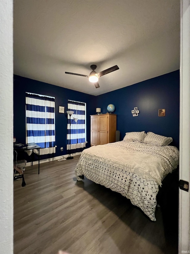 bedroom featuring ceiling fan and wood-type flooring