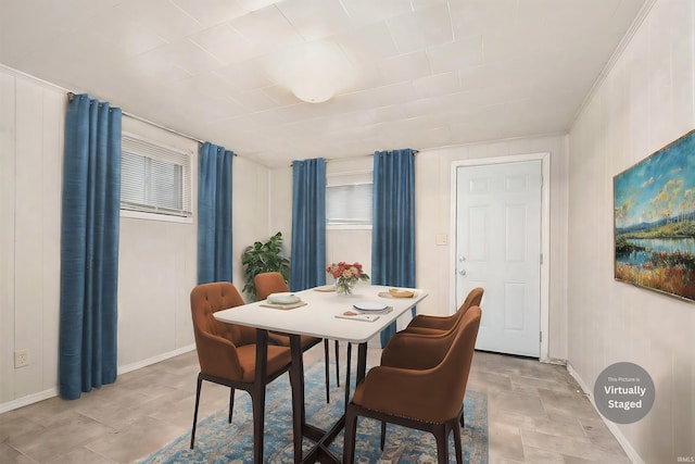 dining room featuring a wealth of natural light and ornamental molding