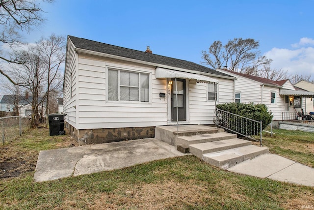 bungalow-style house with a front yard