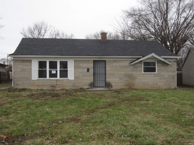 ranch-style house with a front lawn