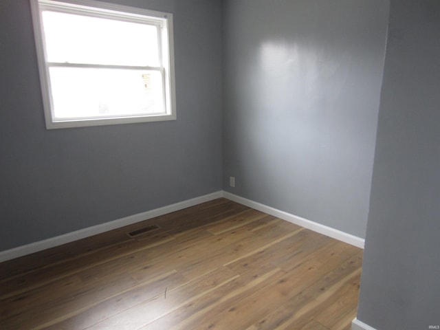 unfurnished room featuring wood-type flooring