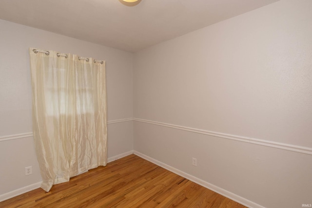 unfurnished room featuring hardwood / wood-style floors