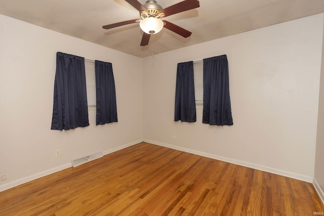 unfurnished room featuring ceiling fan and wood-type flooring