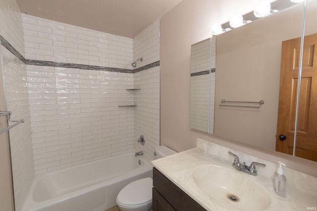 full bathroom featuring vanity, toilet, and tiled shower / bath