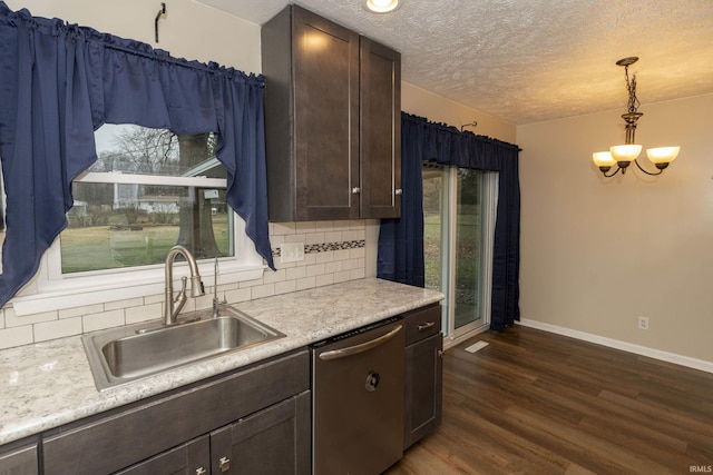 kitchen featuring dishwasher, sink, tasteful backsplash, dark hardwood / wood-style flooring, and decorative light fixtures