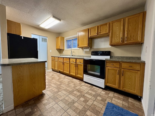 kitchen with white electric range, a textured ceiling, black fridge, and sink