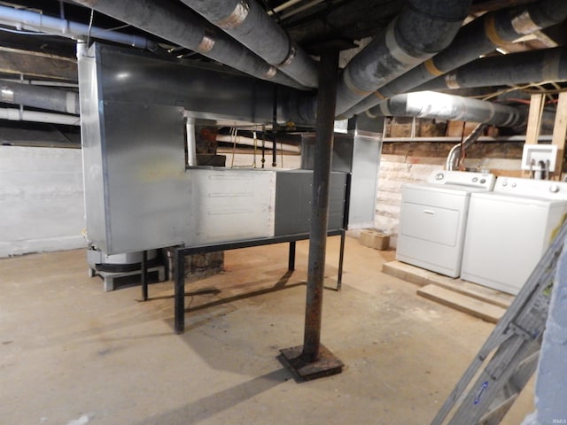 basement featuring washing machine and clothes dryer