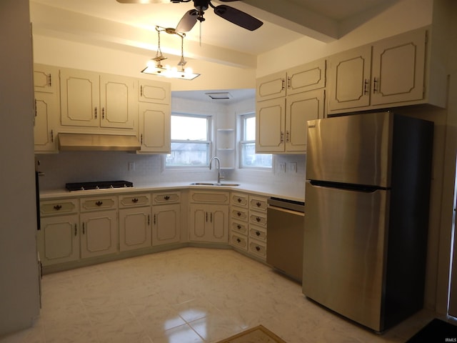 kitchen featuring backsplash, sink, ceiling fan, beam ceiling, and stainless steel appliances