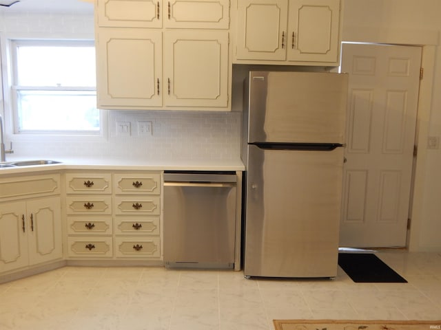 kitchen with backsplash, sink, and stainless steel appliances