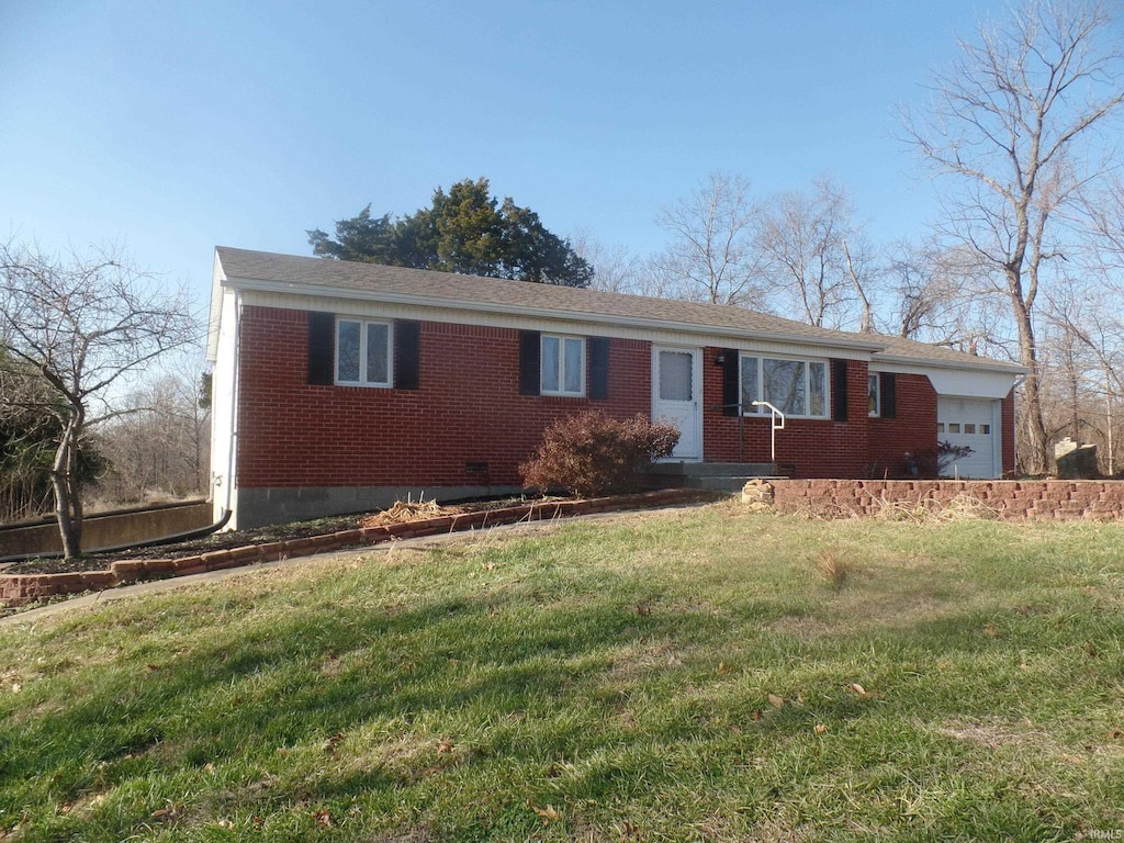 ranch-style house with a garage and a front yard