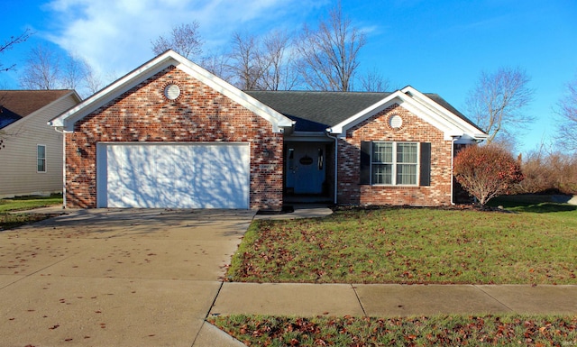 view of front of property featuring a front yard and a garage