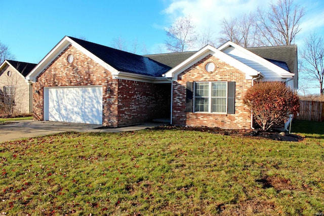 view of front of house with a front yard and a garage