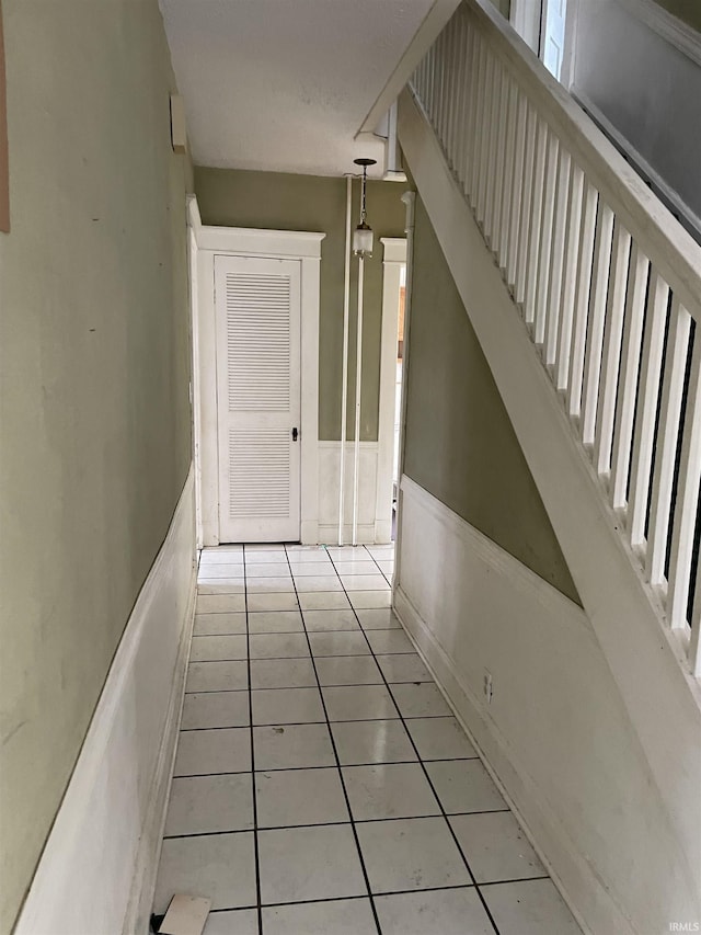 hallway featuring light tile patterned floors