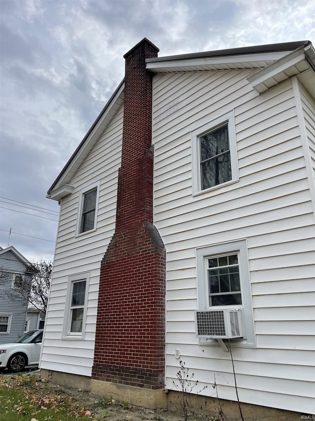 view of property exterior with cooling unit