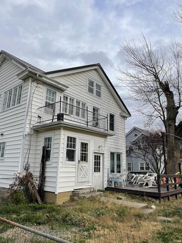 rear view of house featuring a balcony