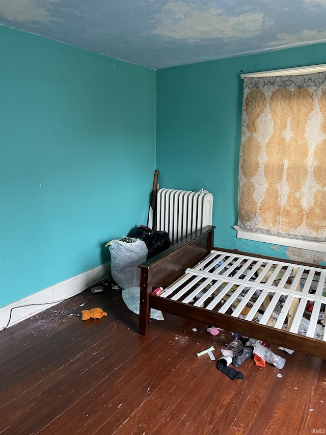 unfurnished bedroom featuring hardwood / wood-style flooring