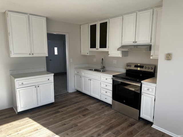 kitchen featuring stainless steel range with electric stovetop, a textured ceiling, sink, white cabinets, and dark hardwood / wood-style floors