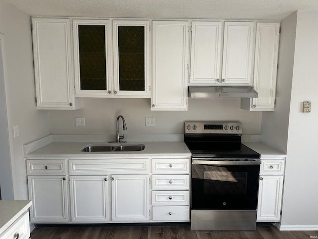 kitchen with dark hardwood / wood-style flooring, a textured ceiling, sink, white cabinets, and stainless steel electric range oven