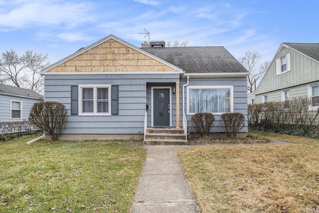 bungalow-style home featuring a front yard