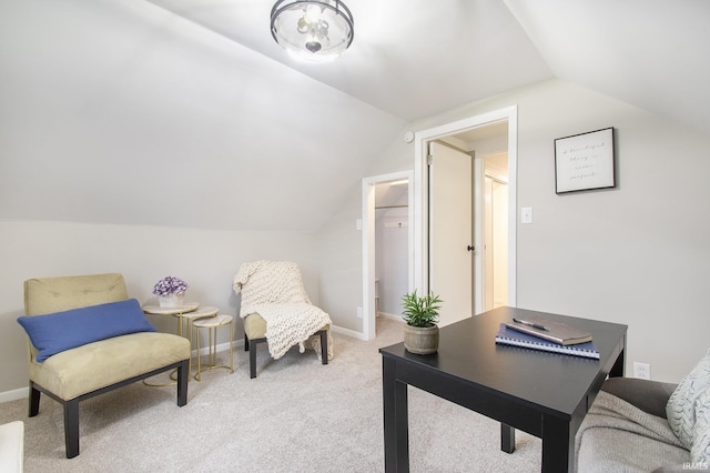 office with light colored carpet and vaulted ceiling