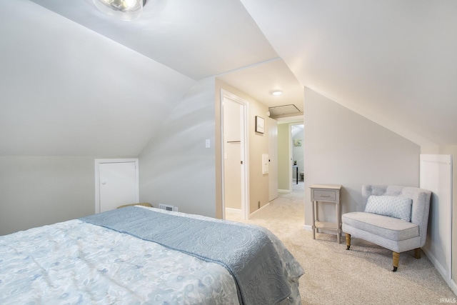 carpeted bedroom featuring vaulted ceiling