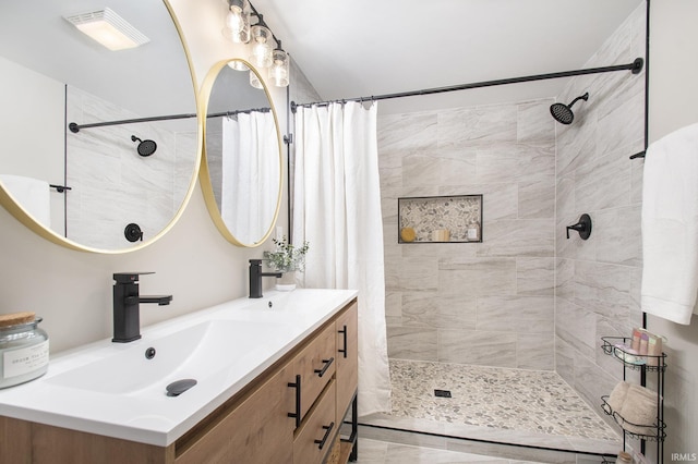 bathroom featuring a shower with curtain and vanity